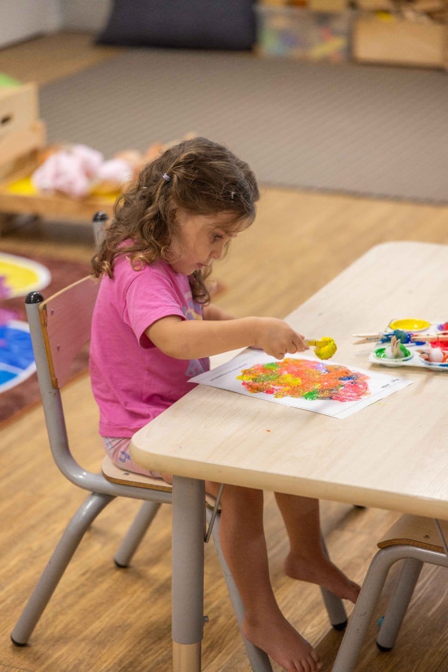 Senior Kindy, a child painting